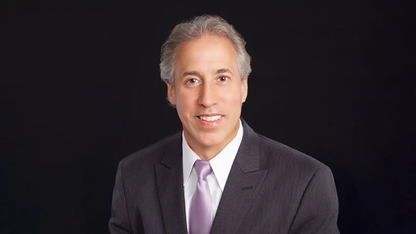 Dentist John R. Striebel Smiling In Suit